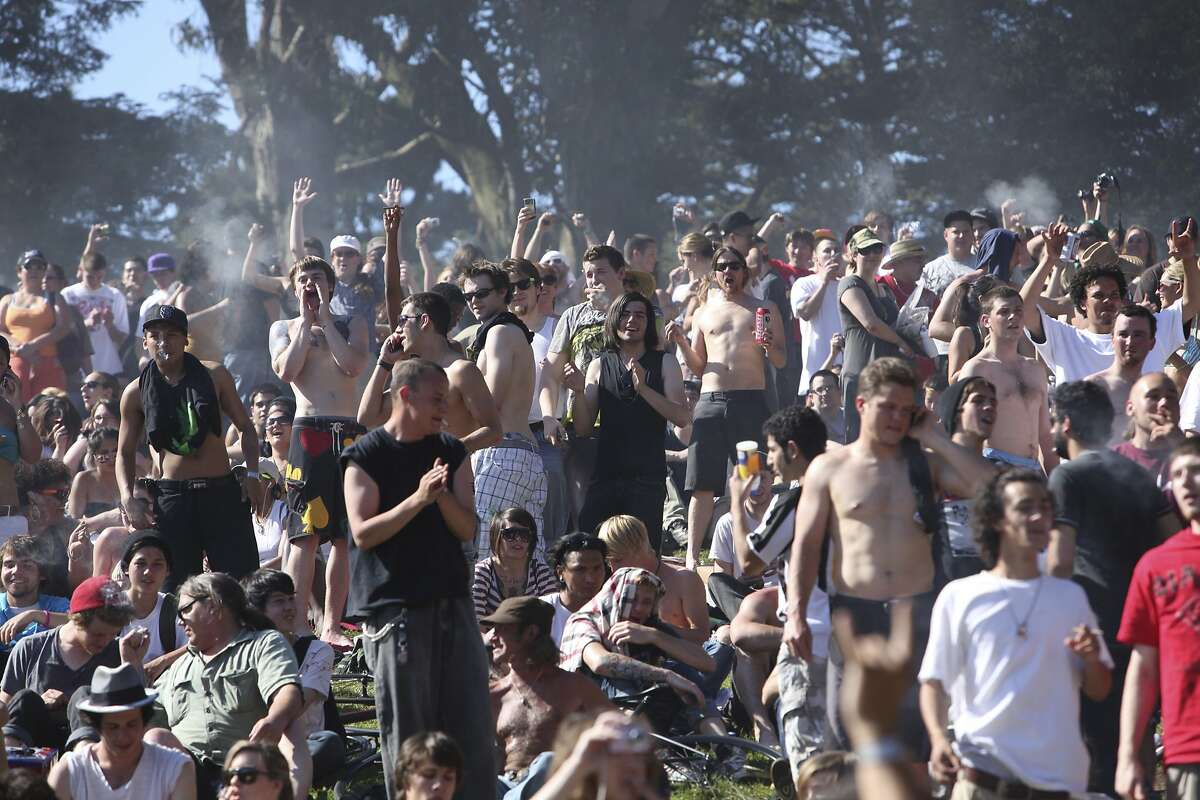 FILE - In this April 20, 2009 file photo, a large crowd cheers as the time reaches 4:20 p.m. on Hippie Hill in Golden Gate Park in San Francisco. A commission led by California Lt. Gov. Gavin Newsom is releasing its recommendations on Wednesday, July 22, 2015, for how marijuana should be grown, sold, taxed and kept out of the hands of minors if voters decide to legalize the drug for recreational use next year. (AP Photo/Jeff Chiu, File)