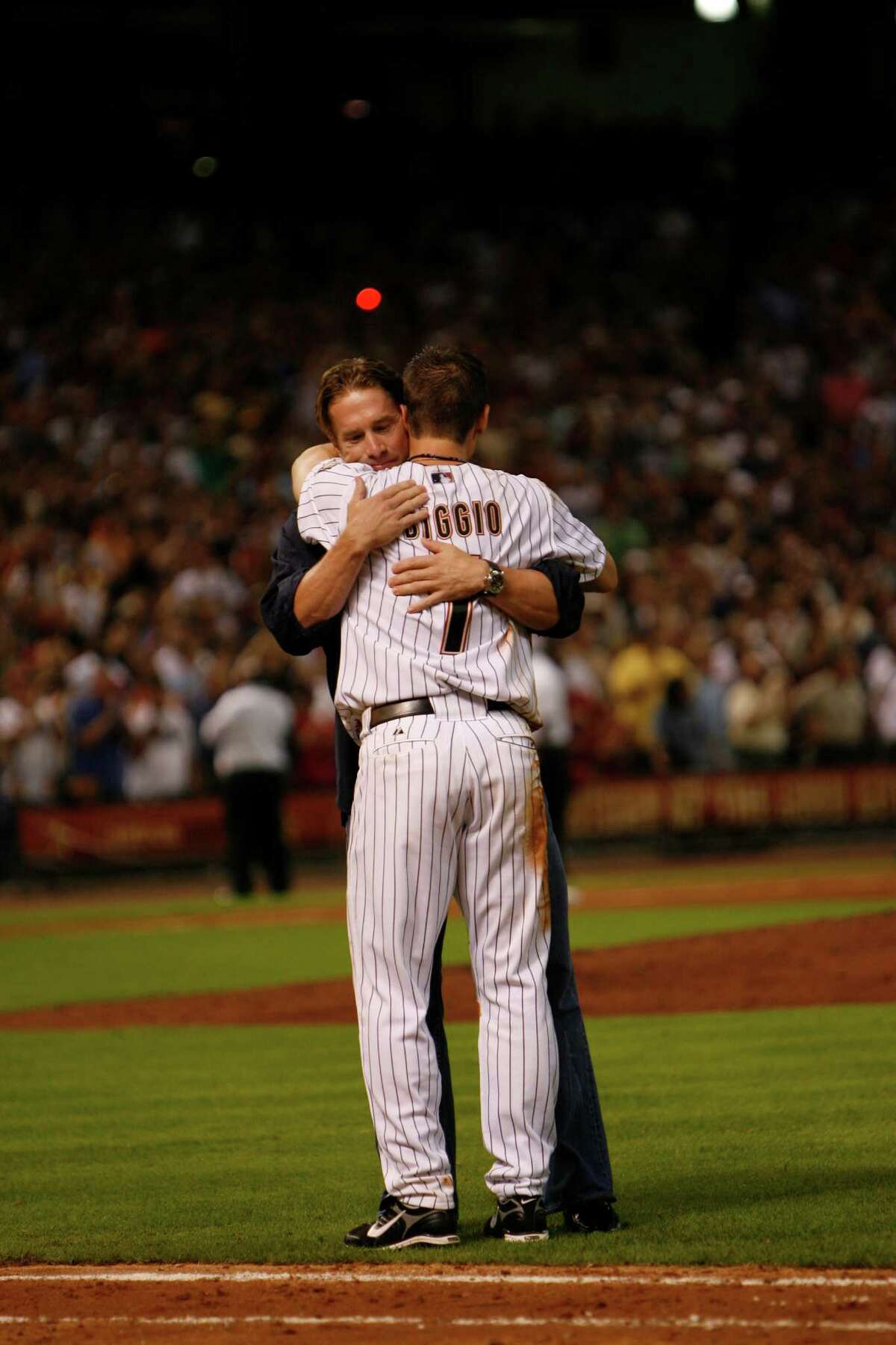 Craig Biggio celebrates with Jeff Bagwell after he singled off of Aaron Cook for the 3000th hit of his career during the seventh inning as the Houston Astros host the Colorado Rockies at Minute Maid Park in Houston, Thursday, June 28, 2007. ( Karen Warren / Chronicle ) "The thing with Baggy is that he and I worked so hard here for this city and for this organization," Biggio said. "We made so many sacrifices as far as playing the game and giving your body to a city, a team."