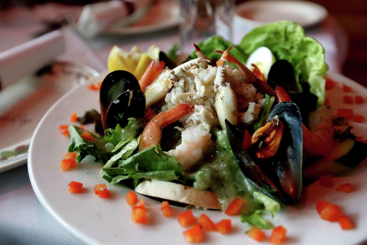A Salade aux Fruits de Mer; fresh shrimp, crabmeat, crab claws, smoked salmon, tuna and mussels served on crisp greens with vinaigrette dressing, ordered by David LaRock at Bistro Le Cep Tuesday, July 21, 2015, in Houston. ( Gary Coronado / Houston Chronicle )