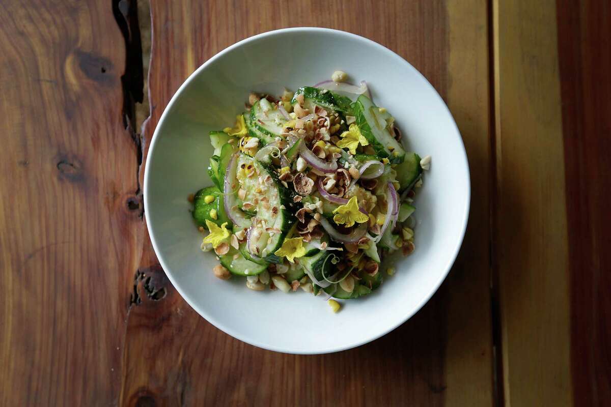 A salad that’s listed only as “cucumber” combined thick slices of the featured vegetable with diced red onions, crushed peanuts, bits of lightly charred corn, fresh basil leaves and a drizzle of a slightly spicy toasted chile oil.