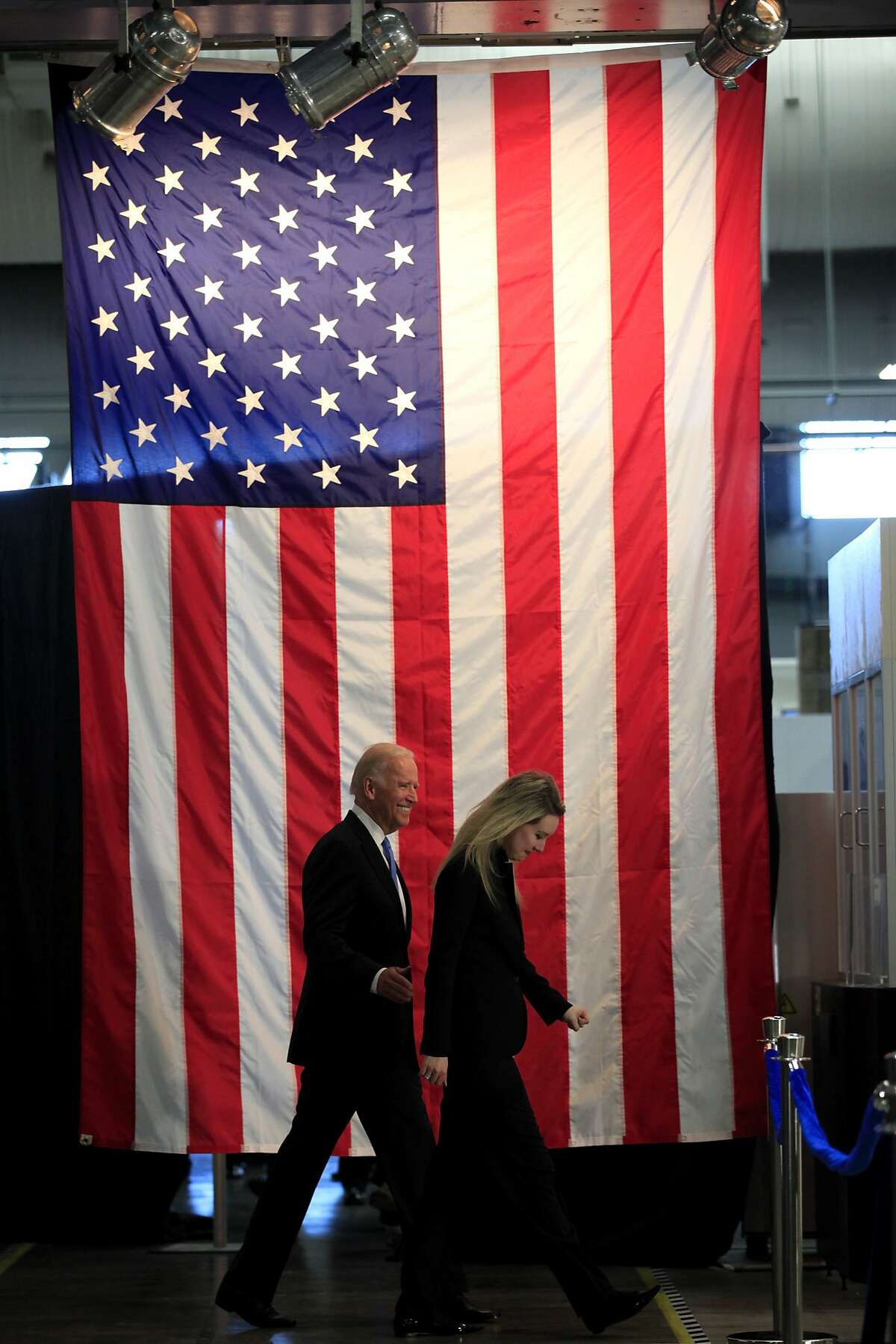 Vice President Joe Biden walks out to a roundtable event after a tour of a Theranos production facility with Elizabeth Holmes, CEO of Theranos, in Newark, California, on Thursday, July 23, 2015.