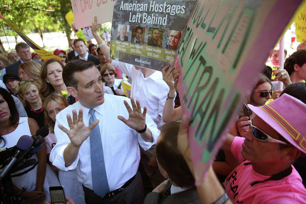 Republican presidential candidate, U.S. Sen. Ted Cruz debates members of the protest group Code Pink during a rally Thursday in Washington, DC. The rally, held to protest the nuclear deal between the U.S. and Iran, was interrupted by Code Pink protesters who support the deal. (Photo by Win McNamee/Getty Images)