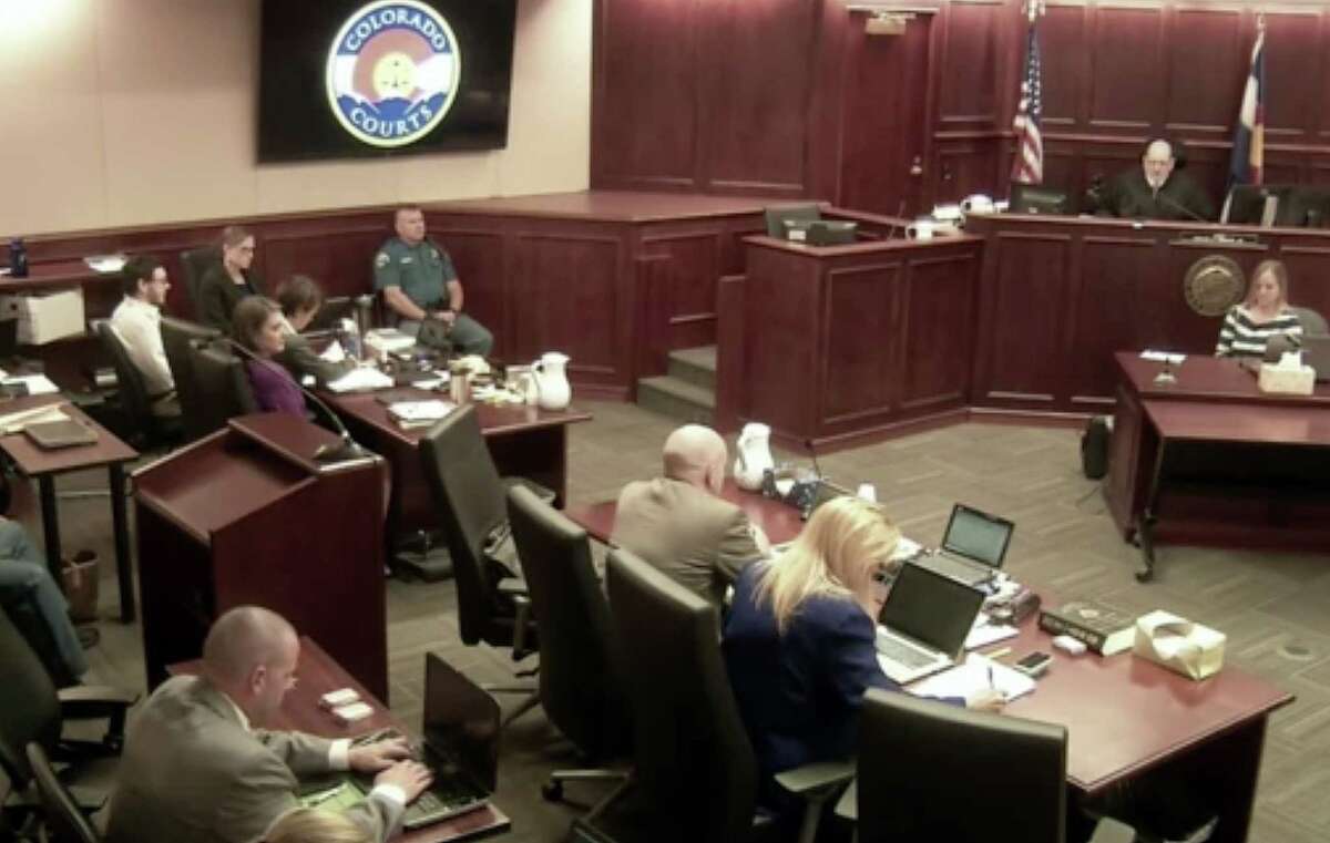 In this image taken from Colorado Judicial Department video, Colorado theater shooter James Holmes, top left in light-colored shirt, sits in Arapahoe County District Court, where his trial continues Thursday, July 23, 2015, in Centennial, Colo. The penalty phase of the trial of Holmes, who could be sentenced to death for killing 12 people in a Colorado movie theater, began Wednesday (Colorado Judicial Department via AP, Pool)