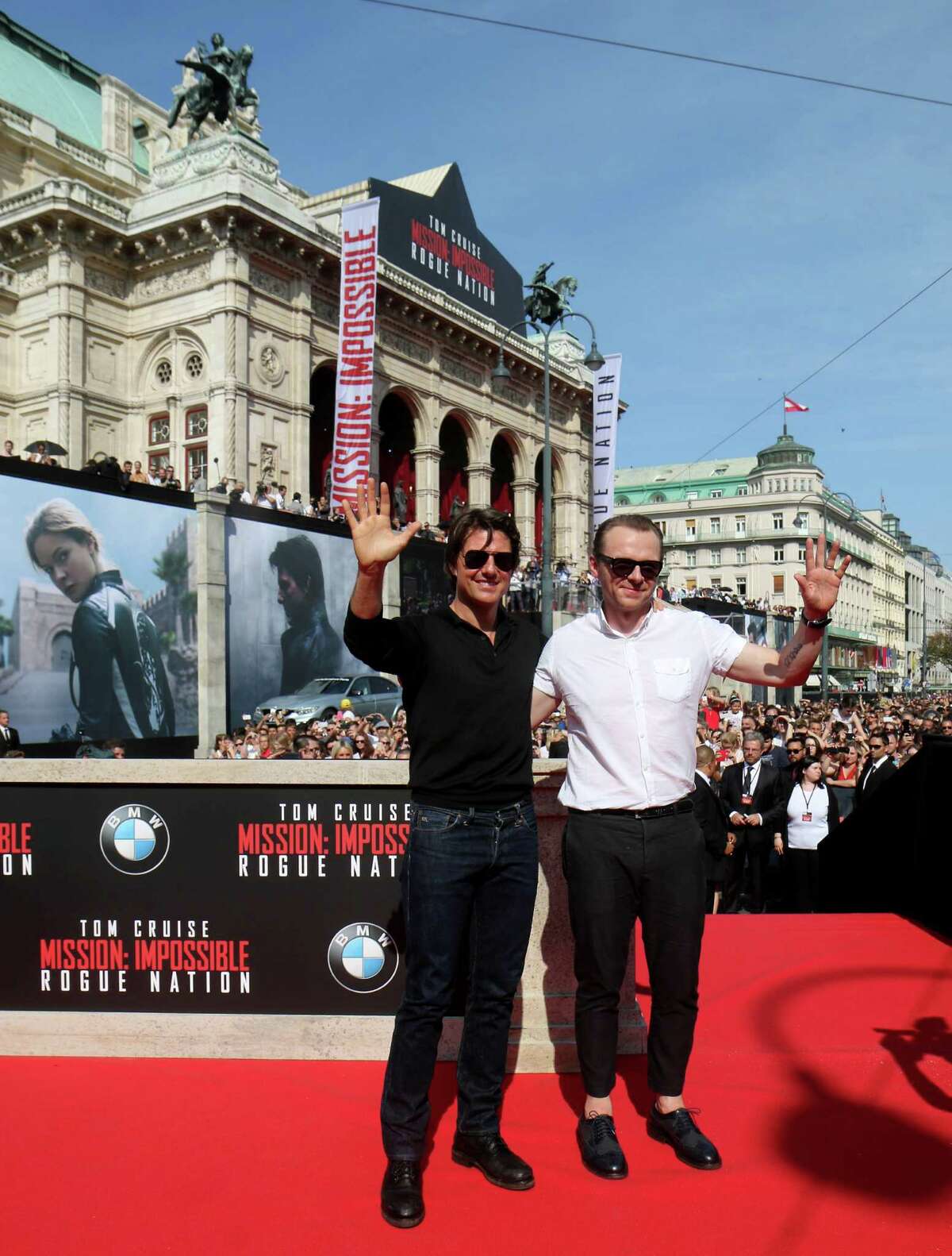British actor Simon Pegg, right, and US actor Tom Cruise, pose for the media as they arrive for the Mission Impossible ?– Rogue Nation World Premiere, at the Vienna State Opera in Vienna, Austria, Thursday, July 23, 2015. (AP Photo/Ronald Zak) ORG XMIT: XRZ108