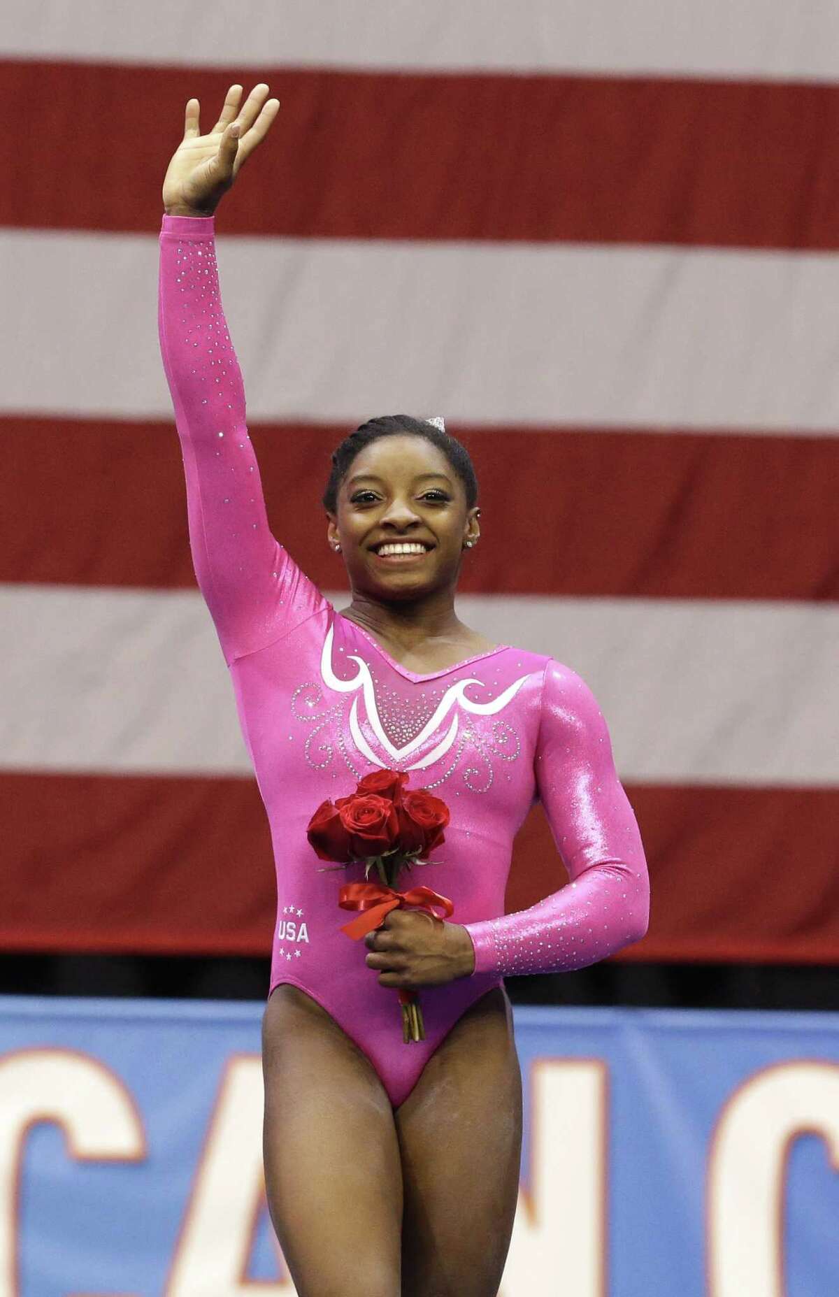 Simone Biles will unveil new routines in floor exercise and uneven bars at Saturday's USA Gymnastics meet in Chicago.