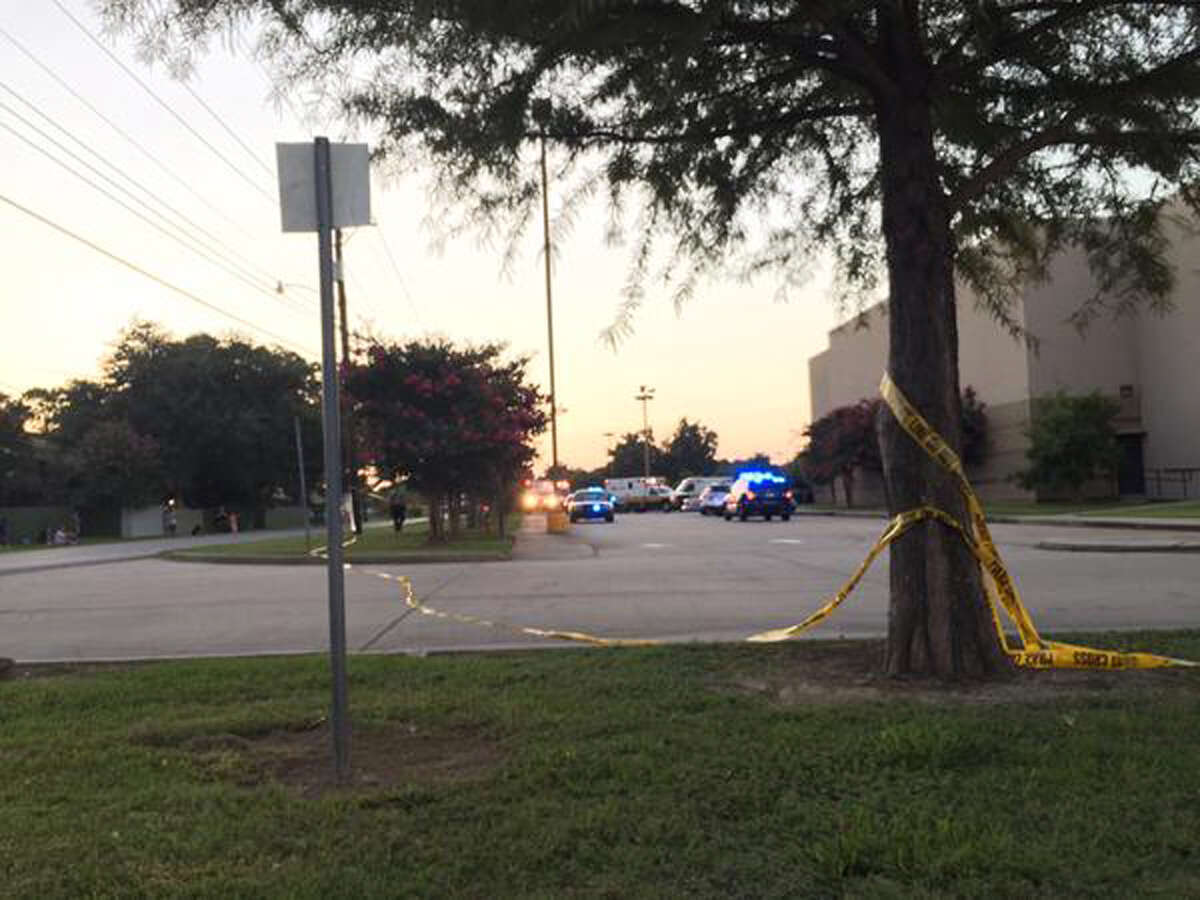 Police tape surrounds the scene following a shooting at a movie theater Thursday, July 23, 2015, in Lafayette, La. (Treylan Arceneaux via AP)