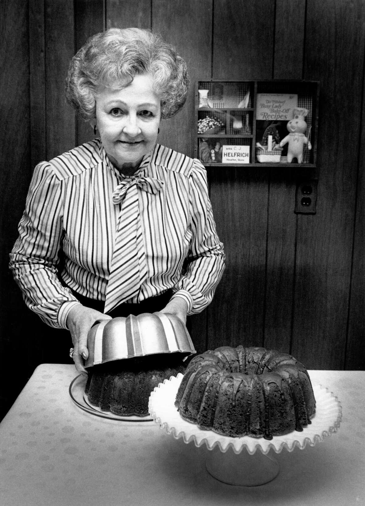 Ella Rita Helfrich is pictured in 1983 with her award-winning Tunnel of Fudge Cake. Helfrich won second place with the cake in the 1966 Pillsbury Bake-off in San Francisco.