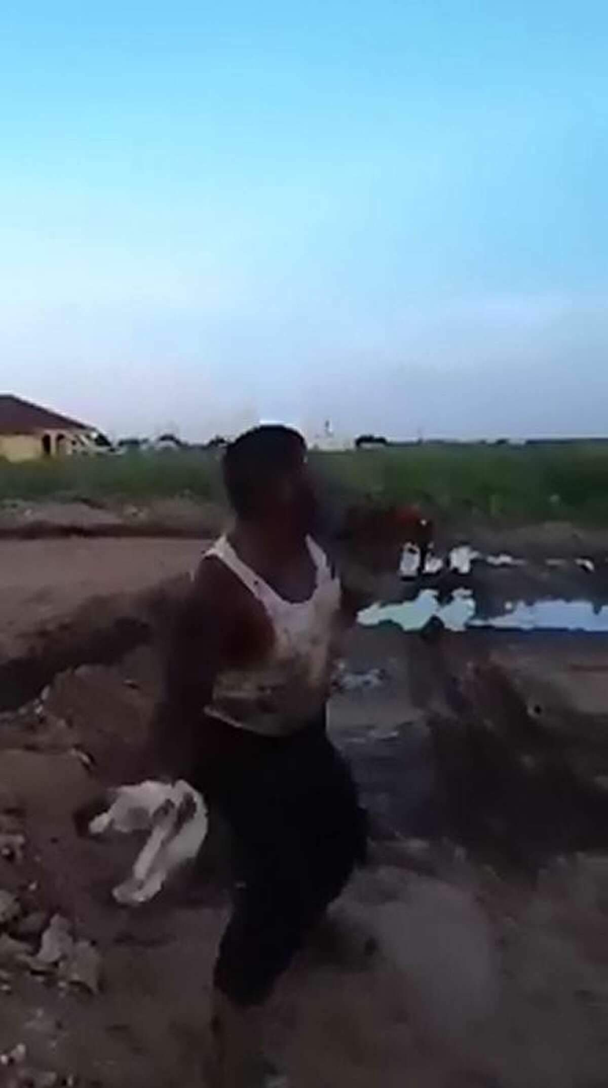 Screengrabs from a video posted online show an Odessa man flinging a small kitten across a field.