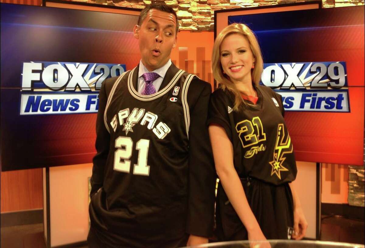 Ernie Zuniga and Jessica Headley love to flash their Spurs support during the morning news on KABB.