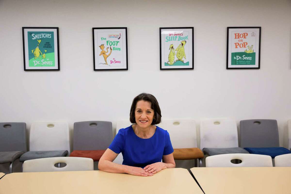 Cathy Goldsmith, art director at Random House Children's Books, sits in front of Dr. Seuss drawings at the company's office in New York, July 20, 2015. Random House is set to release a book recreated from children's author Theodor Seuss Geisel's abandoned pages titled "What Pet Should I Get?," which is likely to be the last complete Dr. Seuss book. (Richard Perry/The New York Times)