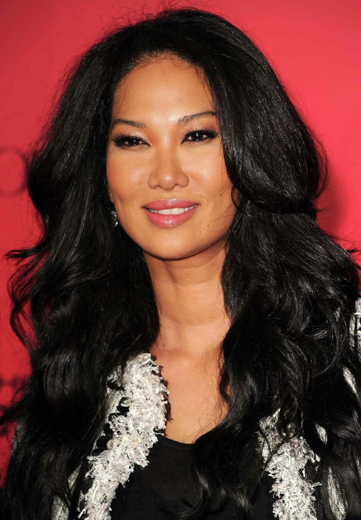 LOS ANGELES, CA - NOVEMBER 18: Kimora Lee Simmons arrives at the "The Hunger Games: Catching Fire" - Los Angeles Premiere at Nokia Theatre L.A. Live on November 18, 2013 in Los Angeles, California. (Photo by Steve Granitz/WireImage)