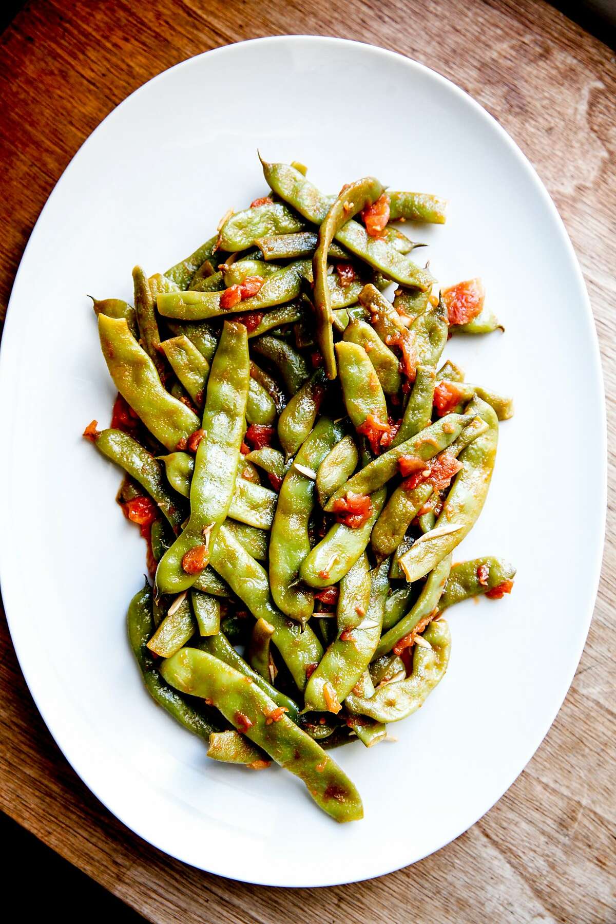 Romano beans smothered in garlicky tomatoes at the home of Molly Watson in San Francisco, Calif., Friday, July 24, 2015.