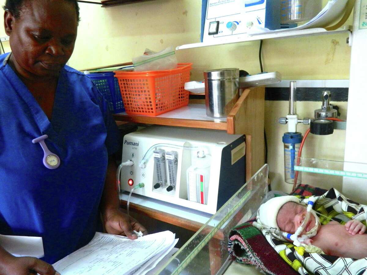 In use: Nurse Florence Mwenifumbo watches over a premature baby receiving CPAP treatment at Queen Elizabeth Central Hospital in Blantyre, Malawi.