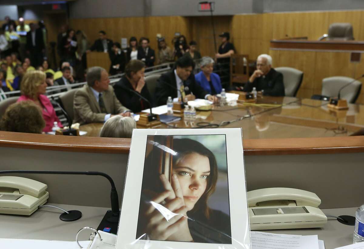 A portrait of Brittany Maynard sits on the dias of the Senate Health Committee at the California Capitol. Maynard, who was dying of brain cancer, used her final days to advocate for California to adopt an aid-in-dying law so others would not have to move out of the state for similar relief.