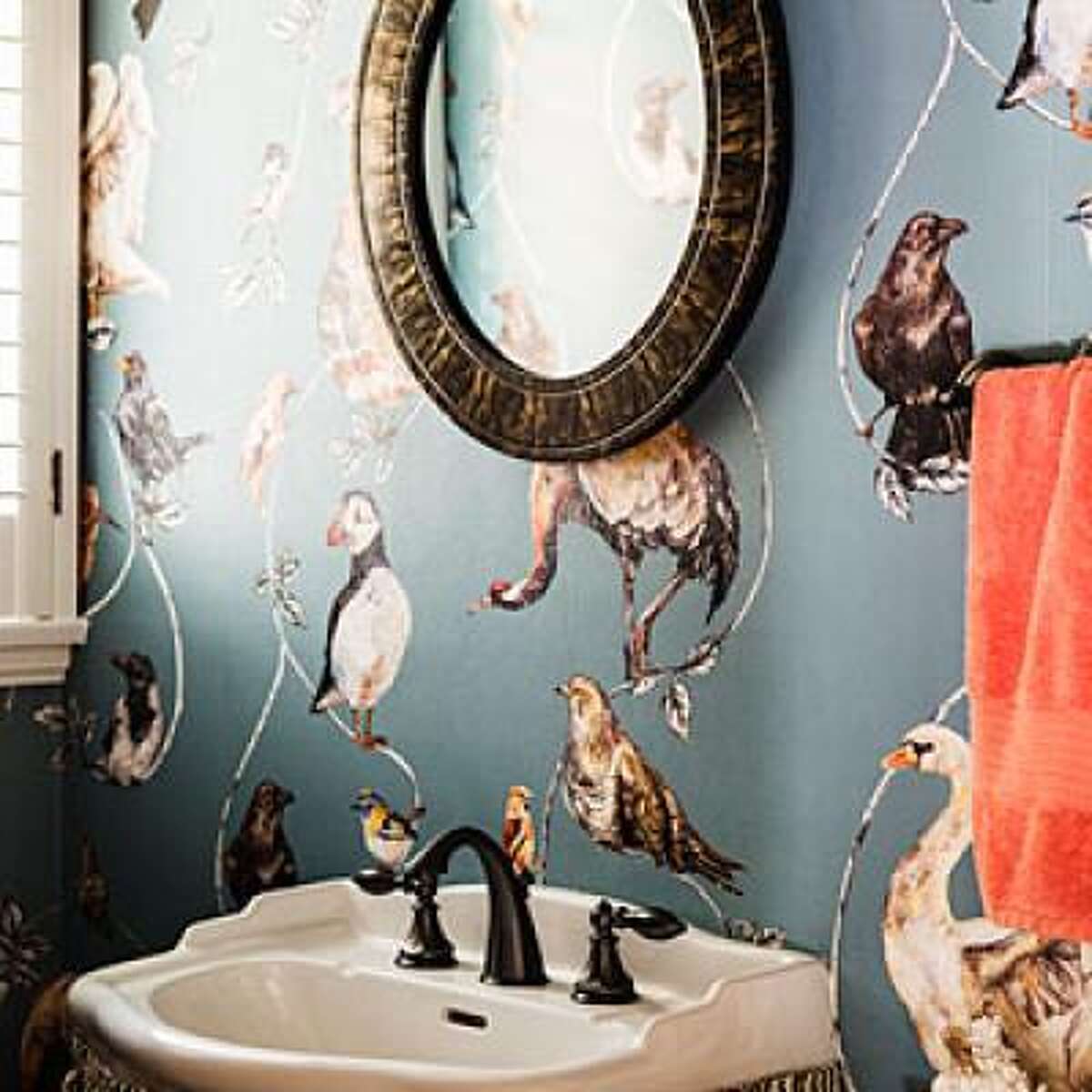 Create a jewel box A small bathroom is the perfect place to take a risk since a bold design move won't be overwhelming. Wallpaper is a great alternative in a powder room (where there's no steam) as this updated Colonial house shows, but a bold wall color or colorful tile has the same striking effect. Tour this entire colonial makeover