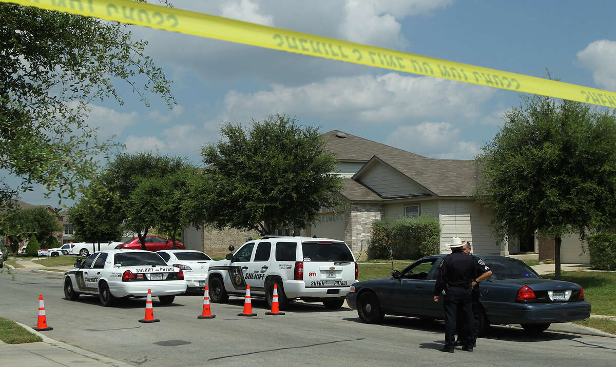Bexar County Sheriff's deputies investigate Friday July 24, 2015 on Stag Horn Mill at the scene of a shooting that started at nearby Elolf Elementary School. One of the involved boys was found dead on the 8,000 block of Stag Horn Mill.