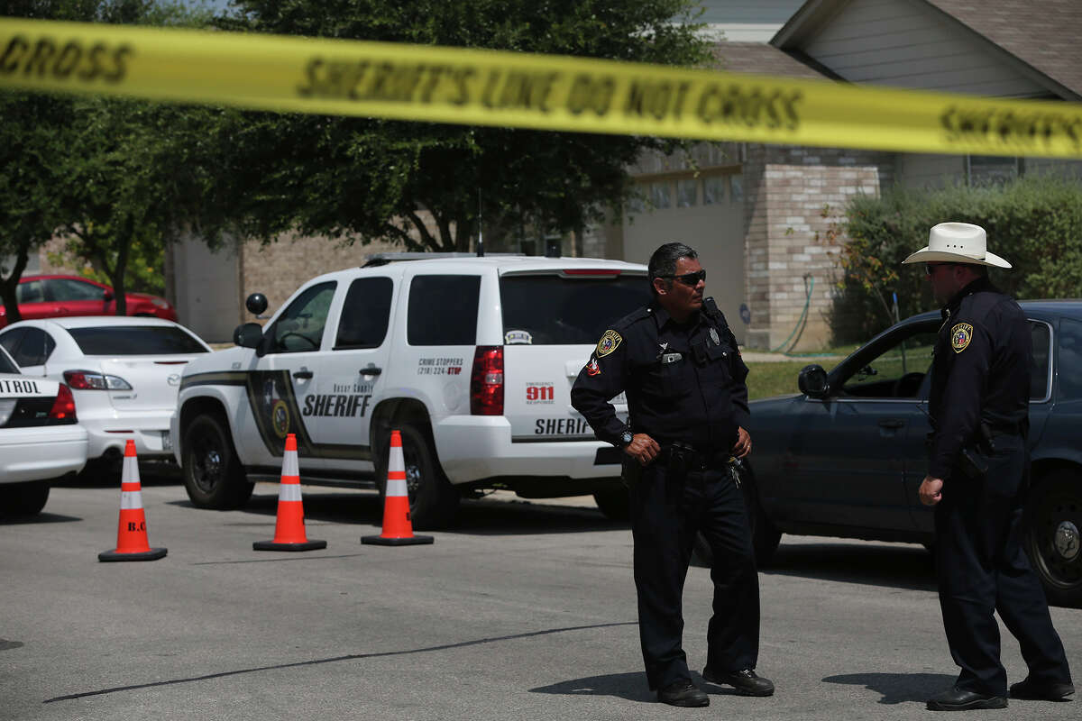 Bexar County sheriff’s deputies work in the 8800 block of Staghorn Mill, where a teenager was found dead, with a gunshot wound, in the driver’s seat of a vehicle.