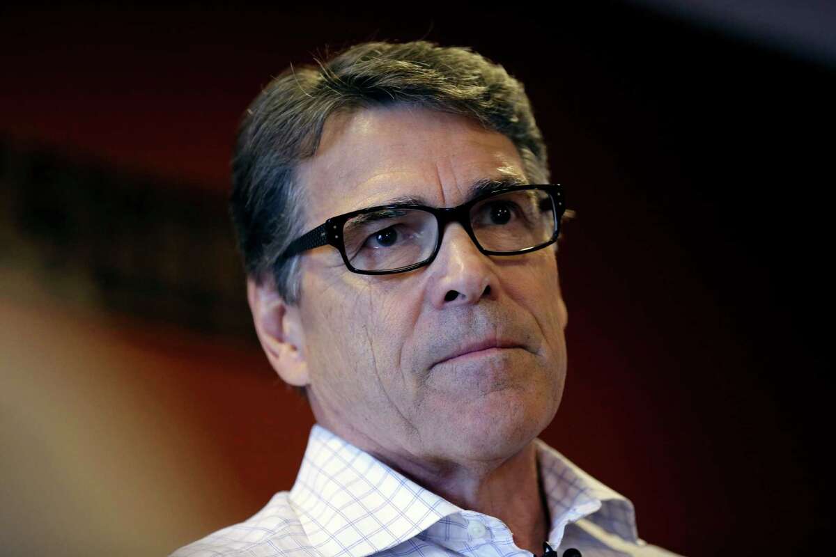 FILE- In this July 13, 2015 file photo, Republican presidential candidate former Texas Gov. Rick Perry speaks during a meet and greet with local residents, in Fort Dodge, Iowa. A Texas appeals court on Friday, July 24, 2015, threw out one of two felony indictments against Perry, a potentially huge legal victory for the 2016 hopeful battling flagging polling numbers in the race for the Republican presidential nomination. (AP Photo/Charlie Neibergall, File)
