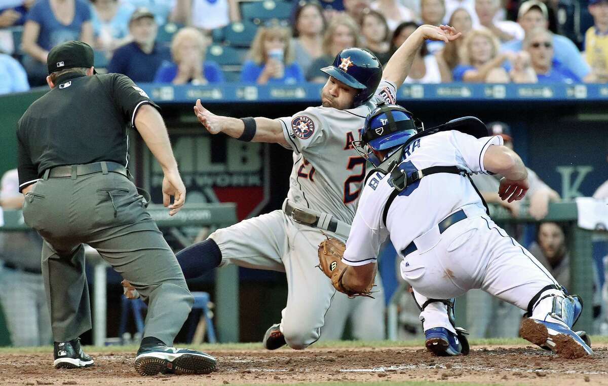 Jose Altuve is tagged out at the plate by Royals catcher Drew Butera, right, while trying to score from first base on a double by Preston Tucker in the fourth inning. The Astros would not need the run, however, going on to win 4-0 on Friday.﻿