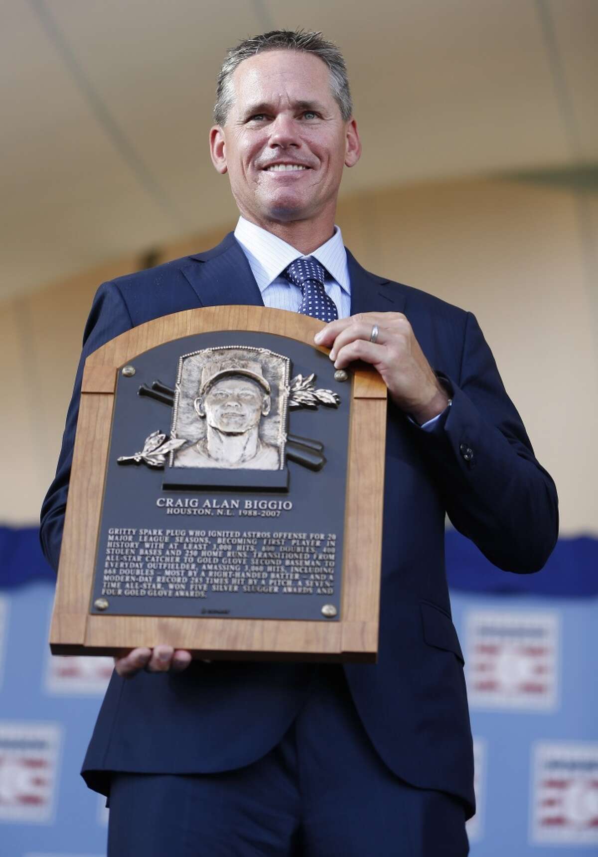Craig Biggio holds his Hall of Fame plaque at the conclusion of the Hall of Fame induction ceremony on the grounds at Clark Sports Center on Sunday, July 26, 2015, in Cooperstown. ( Karen Warren / Houston Chronicle )
