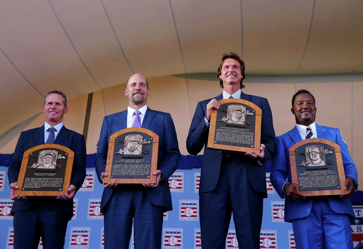 COOPERSTOWN, NY - JULY 26: 2015 Inductees Craig Biggio,John Smoltz,Randy Johnson and Pedro Martinez pose with their plaques after the Induction Ceremony at National Baseball Hall of Fame on July 26, 2015 in Cooperstown, New York. (Photo by Elsa/Getty Images) ORG XMIT: 560218733
