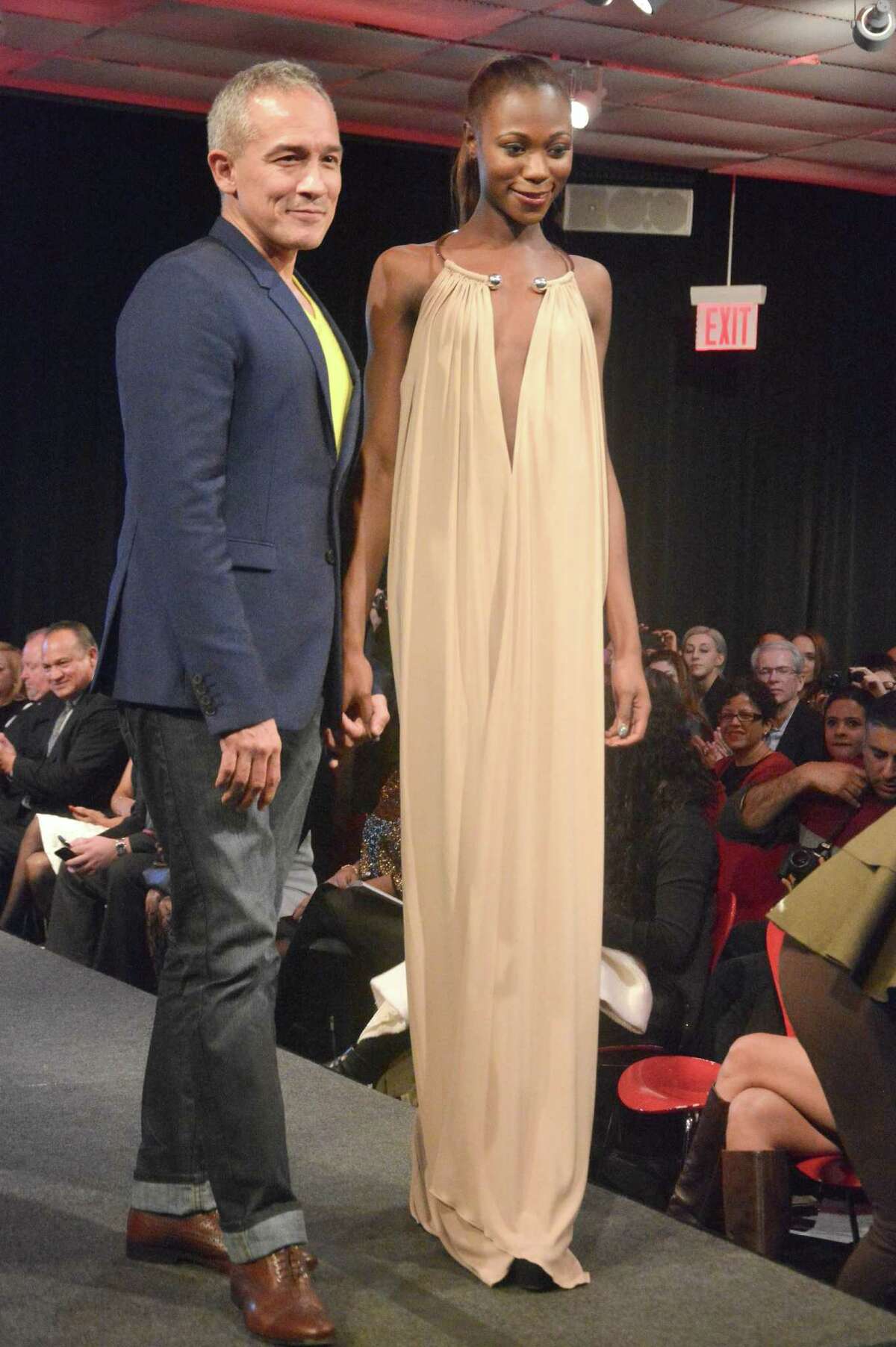 Houston-born designer and New York Fashion Week regular Cesar Galindo, third from left, strikes a pose with models after showing his fall/winter 2015 collection in New York. On July 30, 2015, Galindo will present a free fashion show at San Antonio’s St. Anthony Hotel highlighting that collection.