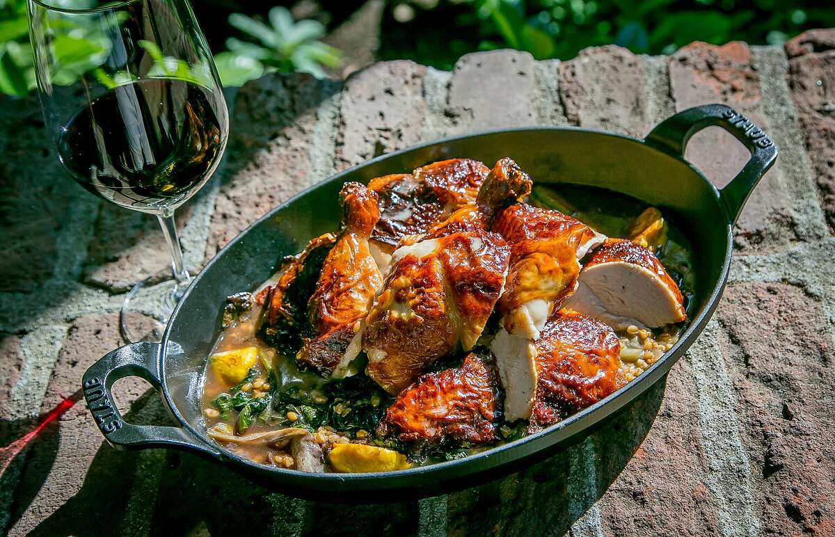 The Roast Chicken with a glass of red wine at Harvest Table in St. Helena, Calif., is seen July 26th, 2015.