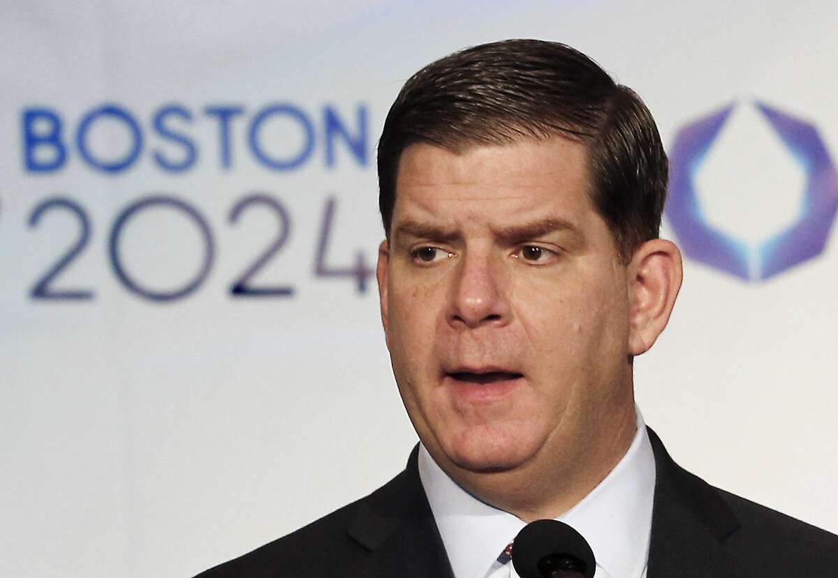 FILE - In this Jan. 9, 2015, file photo, Boston Mayor Martin Walsh speaks during a news conference in Boston after the city was picked by the USOC as its bid city for the 2024 Olympic Summer Games. Walsh said Monday, July 27, 2015, he won't sign a host city contract, which is key to the city's bid, without more assurances that taxpayers won't foot the bill. (AP Photo/Winslow Townson, File)