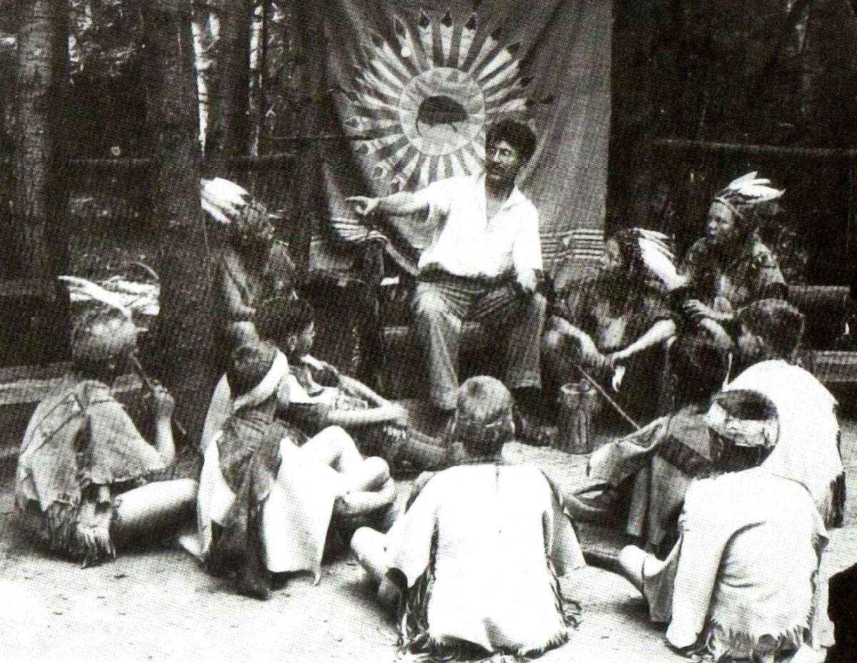Ernest Thompson Seton enthralls local Cos Cob youth with his many Indian tales - circa 1904. The youngsters were among the earliest members of Seton's Woodcraft Indians and met at the artist and conservationist's Cos Cob estate, Wyndygoul. Seton and his Woodcraft Indians would play a major role in the establishment of the Boy Scouts of America.