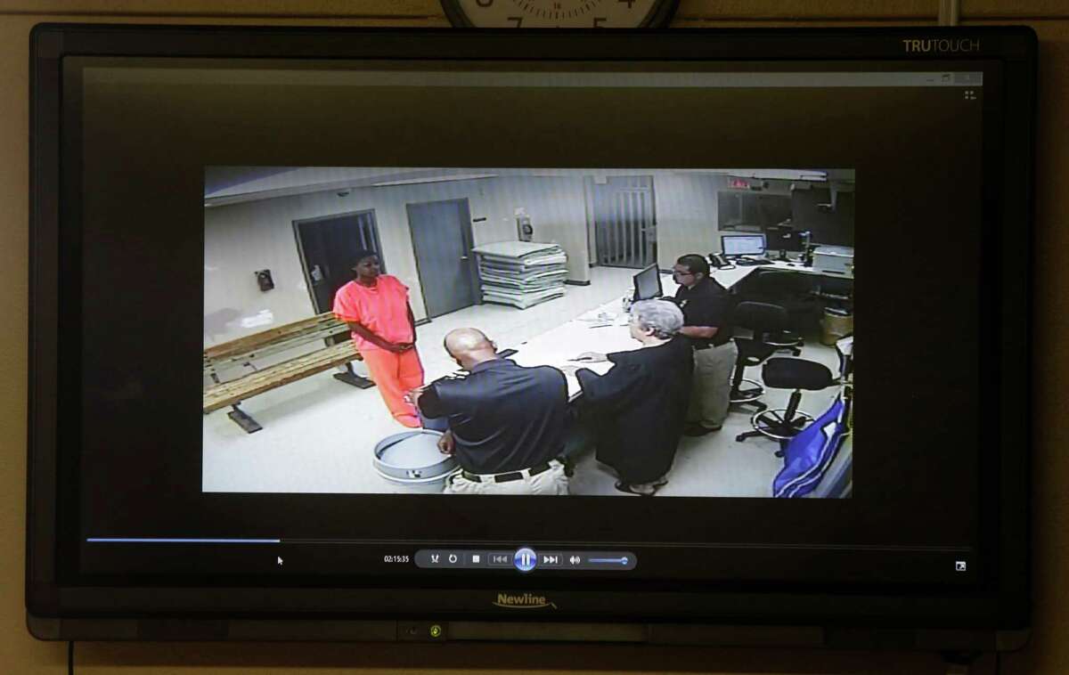 A video of Sandra Bland going through magistration in the Waller County Jail is shown during a media conference at the Waller County Courthouse Tuesday, July 24, 2015 in Hempstead.