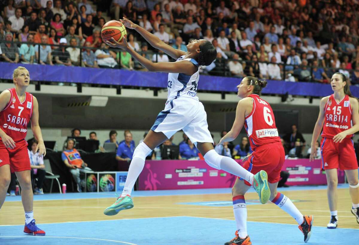 Valeriane Ayayi (with ball) averaged 12.8 points, 4.8 rebounds and 1.3 steals per game in Euroleague play for Basket Lattes Montpellier in France. The Stars cut Kalana Green to make room.