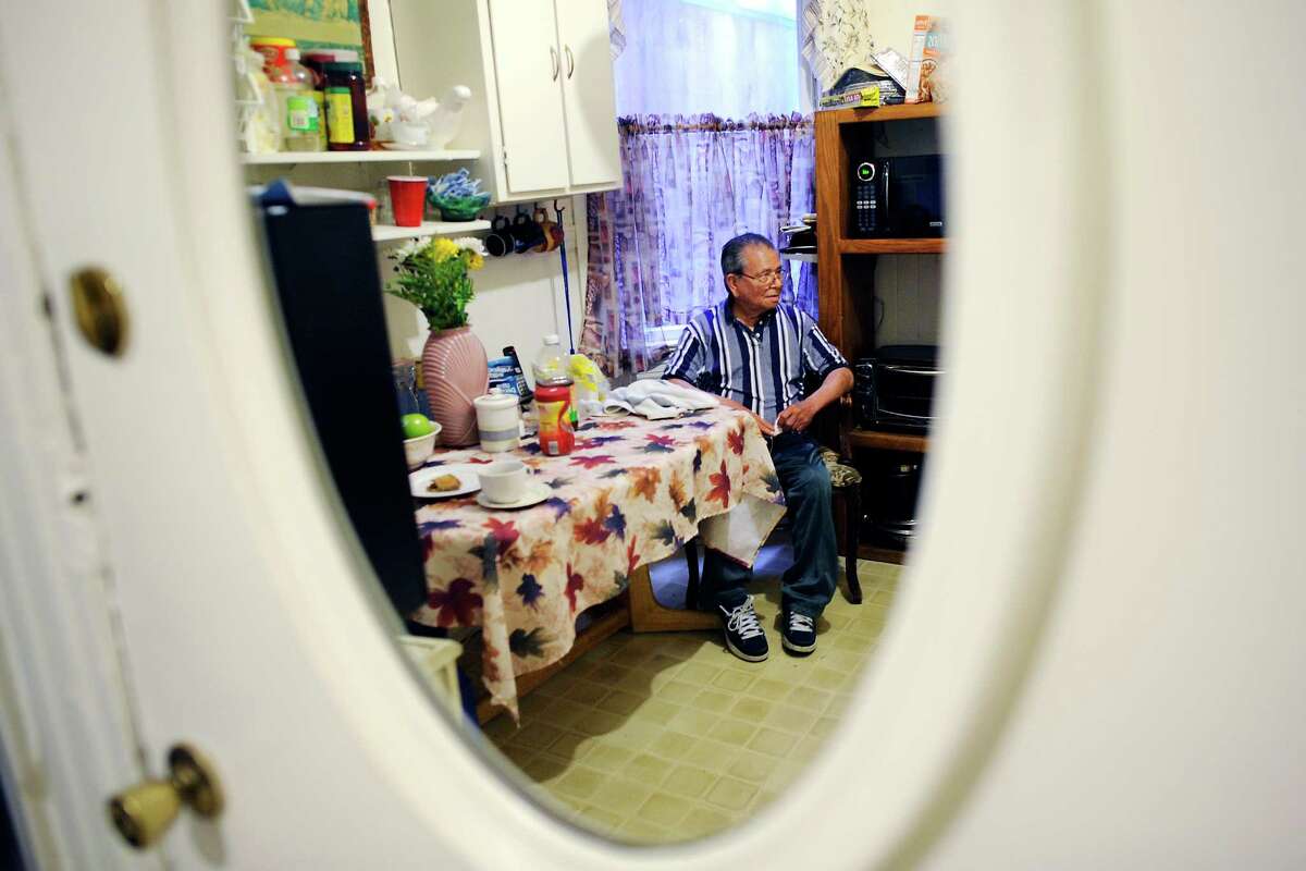 Guillermo Manzanares, 87, sits in the kitchen of the Mission District apartment he has called home for 50 years but is now being evicted from on July 26, 2015.