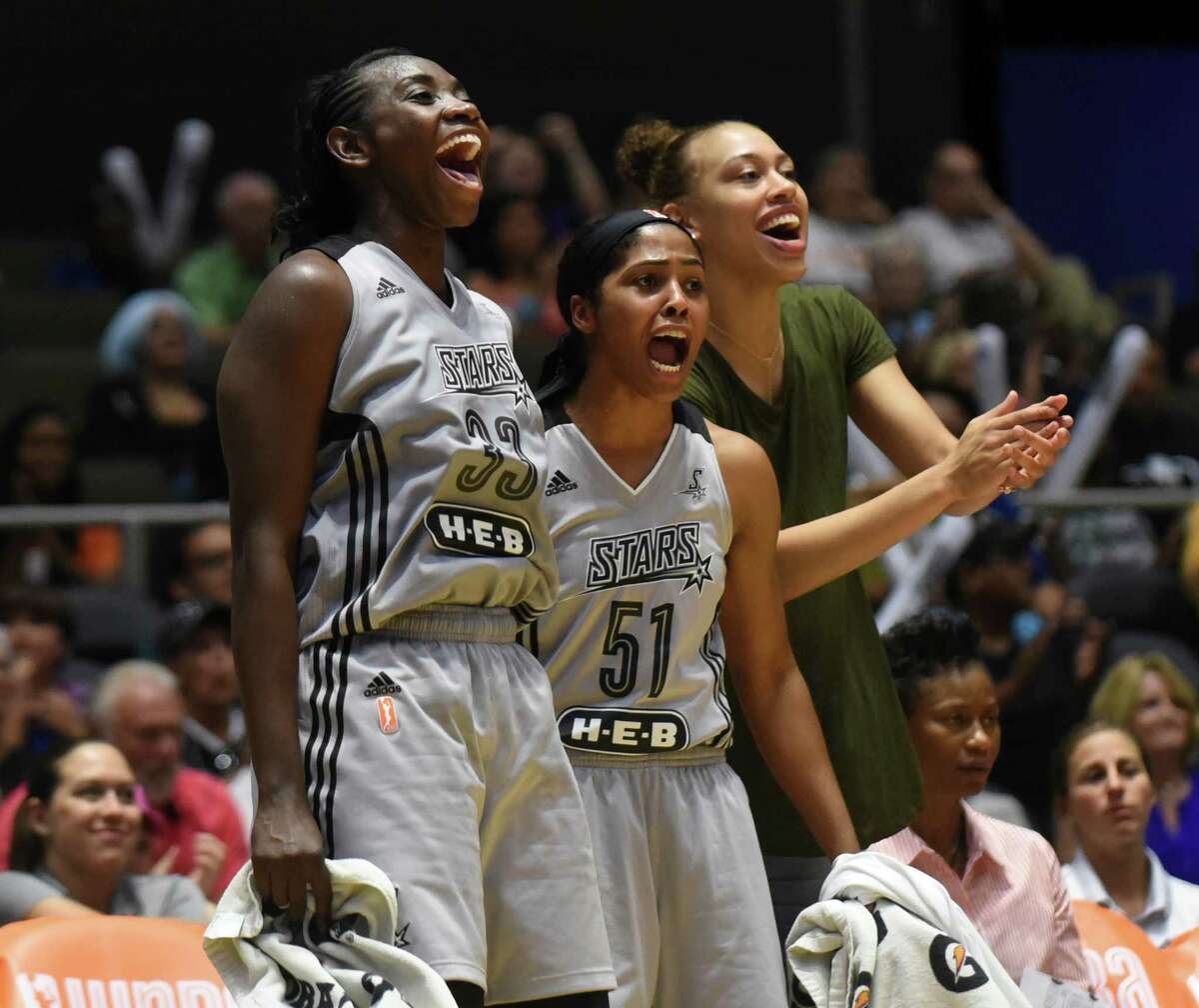 Sophia Young-Malcolm (33) and Sydney Colson (51) react to the action on the court during WNBA action against Atlanta at Freeman Coliseum on Wednesday, July 29, 2015.