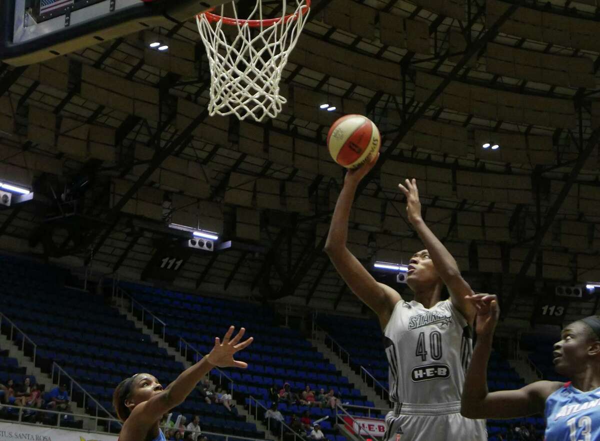 Kayla Alexander of the San Antonio Stars shoots and scores from inside the key during WNBA action against the Atlanta Dream at Freeman Coliseum on Wednesday, July 29, 2015.