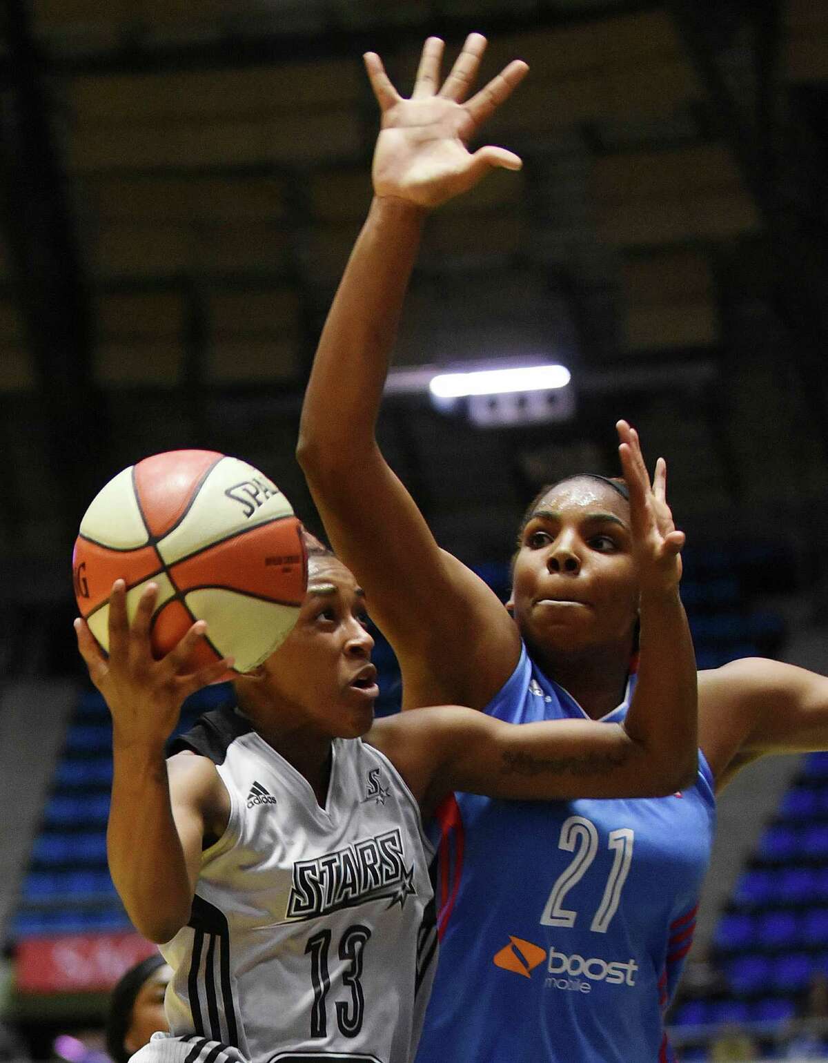 Danielle Robinson of the San Antonio Stars drives against Reshanda Gray of the Atlanta Dream during WNBA action at Freeman Coliseum on Wednesday, July 29, 2015.