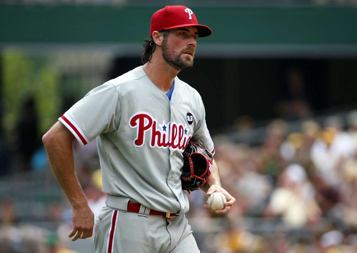 FILE - In this June 14, 2015, file photo, Philadelphia Phillies starting pitcher Cole Hamels collects himself on the mound during the fourth inning of a baseball game against the Pittsburgh Pirates in Pittsburgh. Two people familiar with the deal say the Phillies have agreed to trade Hamels to the Texas Rangers for a package of prospects. Both people spoke to The Associated Press late Wednesday night, July 29, 2015, on condition of anonymity because the trade has not been finalized. Hamels has a limited no-trade clause but does not have to approve a deal to the Rangers. (AP Photo/Gene J. Puskar, File)