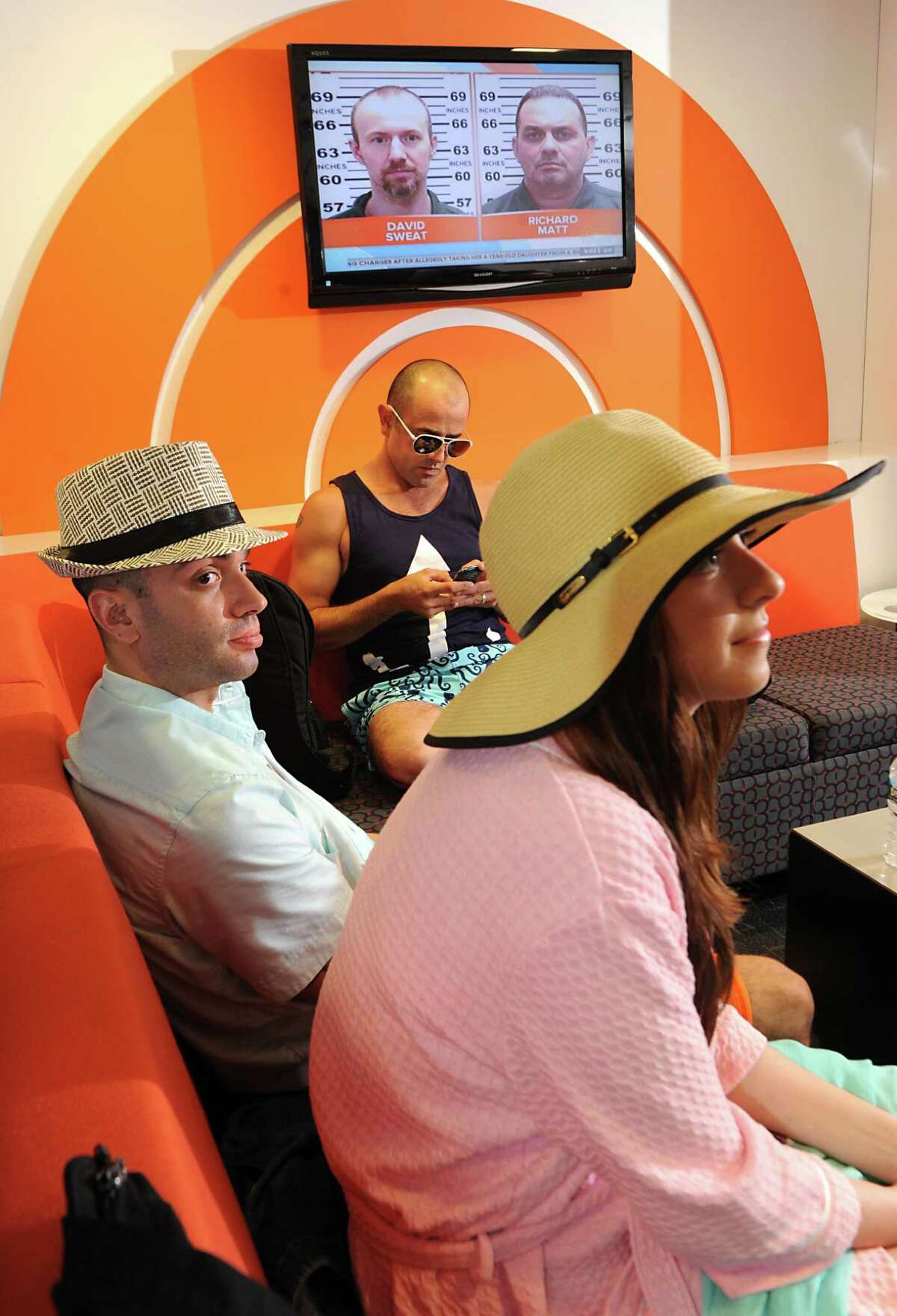 Models Ashely Veley of Clifton Park, right, Daniel Weiss of Clifton Park, left, and Frank Dianda of Hudson wait in the green room before appearing on The Today Show on Wednesday, June 10, 2015 in New York, N.Y. (Lori Van Buren / Times Union)