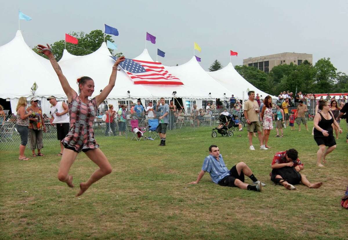 Liz Bouchard, of Arundel, Maine, dances to the music of the Ryan Montbleau Band at the Gathering of the Vibes at Seaside Park in Bridgeport, Conn., on Thursday July 30, 2015.