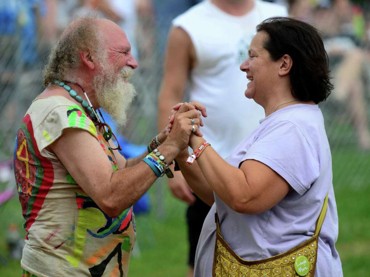 Eric Triffin, of Bethany, greets his good friend Terry Malone, of Fort Pierce, FL, at the Gathering of the Vibes at Seaside Park in Bridgeport, Conn., on Thursday July 30, 2015. Malone, who just moved to Florida, was a reseident of Derby.