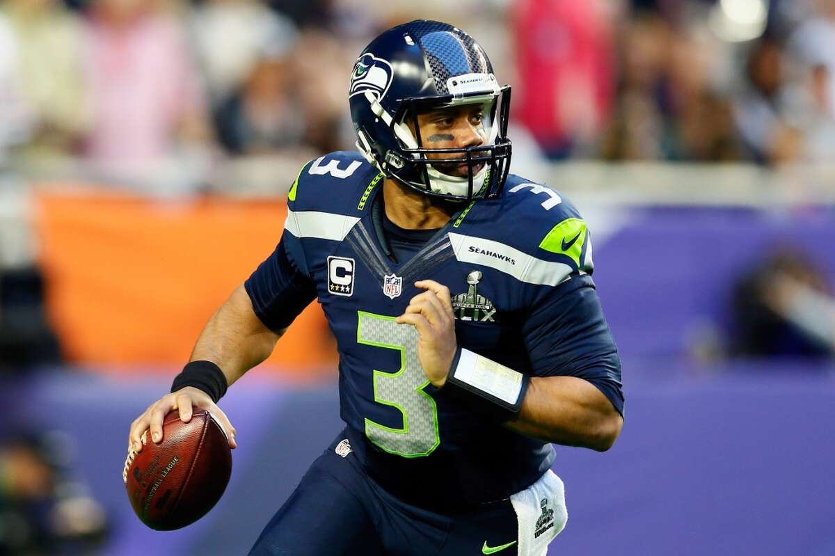 Quarterback: Russell Wilson Years with Seahawks: 2012-present Seahawks stats: 794-of-1,252 passing (63.4 percent), 9,950 yards, 72 touchdowns, 26 interceptions; 308 rushing attempts, 1,877 yards, 11 touchdowns Career stats: Same. Notes: It was a good day for Russell Wilson. Not only did he sign a four-year contract extension with Seattle that makes him one of the highest-paid players in the league, but he also ran away with our quarterback position, racking up over 57 percent of the over 3,200 votes cast.