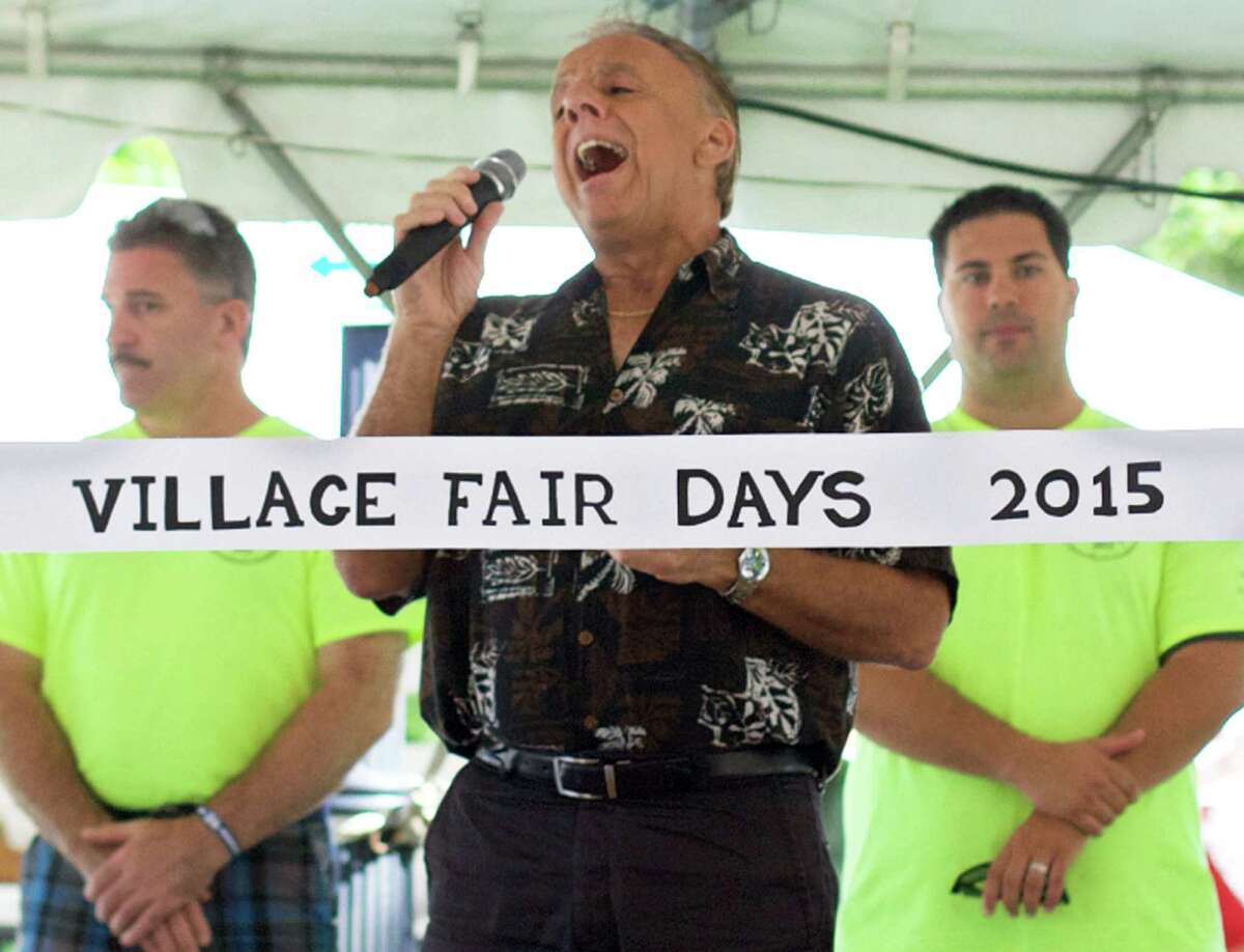 Ray Plue of the band Higher and Higher belts out an inspired "Star Spangled Banner"to help open Village Fair Days.