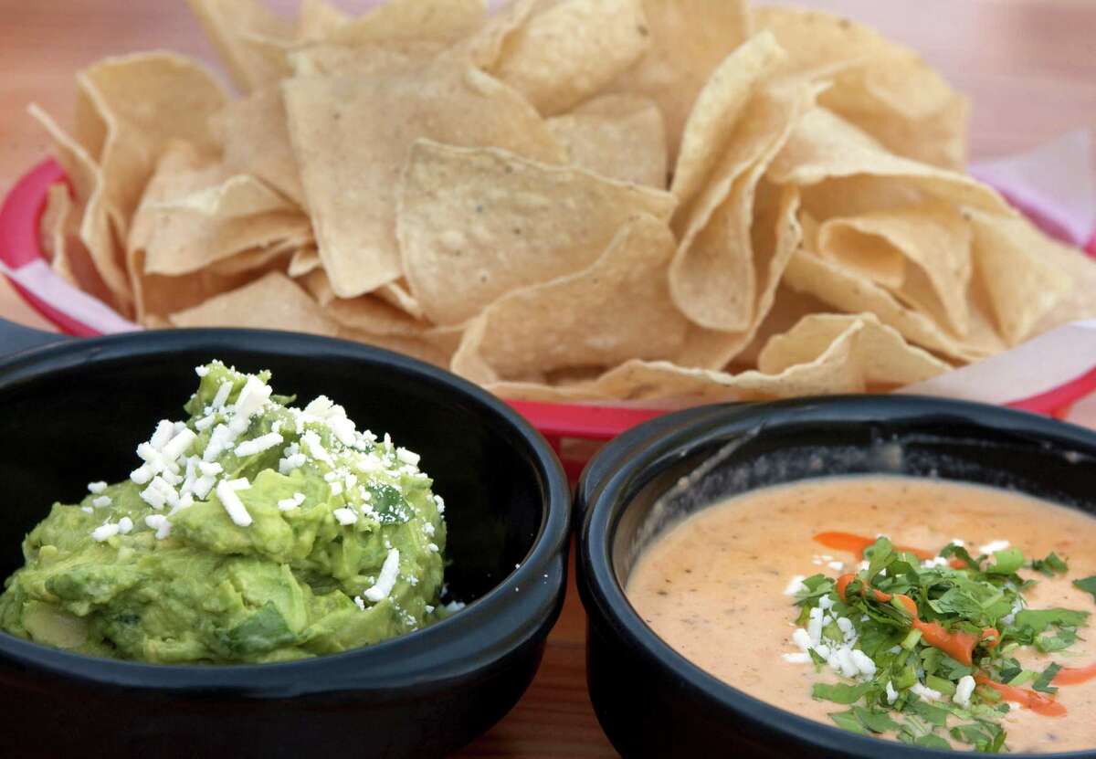 Guacamole, chips and chile queso are photographed at Torchy's Tacos on Sunday, April 22, 2012 in Houston, TX. ( J. Patric Schneider / For the Chronicle )