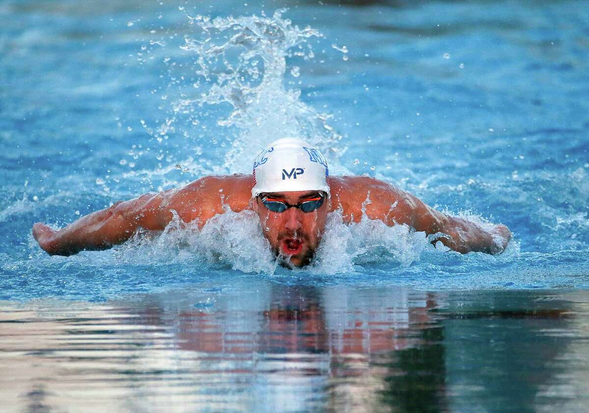 Michael Phelps competes in the men’s 100 meter butterfly final, Thursday, April 16, 2015, at the Arena Pro Swim Series in Mesa, Ariz. It was the first competition for the 18-time Olympic champion after serving a six-month suspension for DUI.
