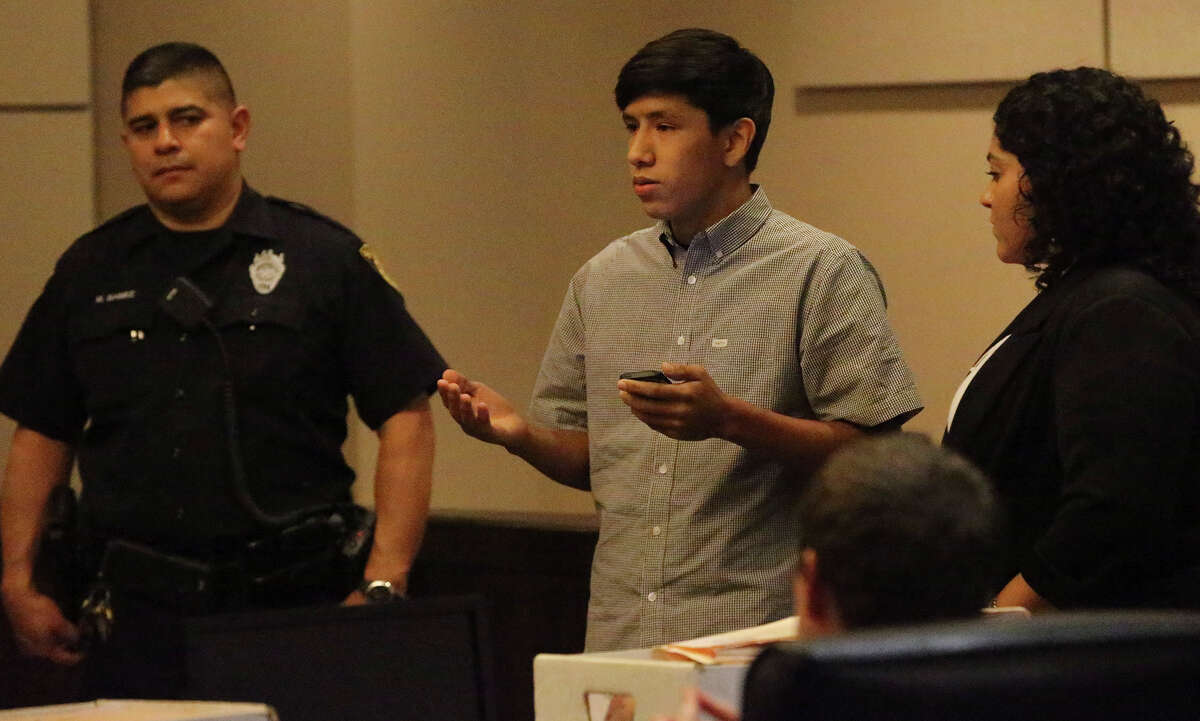 Ahn Cisneros, 17, reads a victim's impact statement to Jose Gonzalez, who was found guilty of shooting to death his father. The teen said he forgives Gonzalez, who nodded his head and mouthed the words “thank you” when Ahn finished reading.