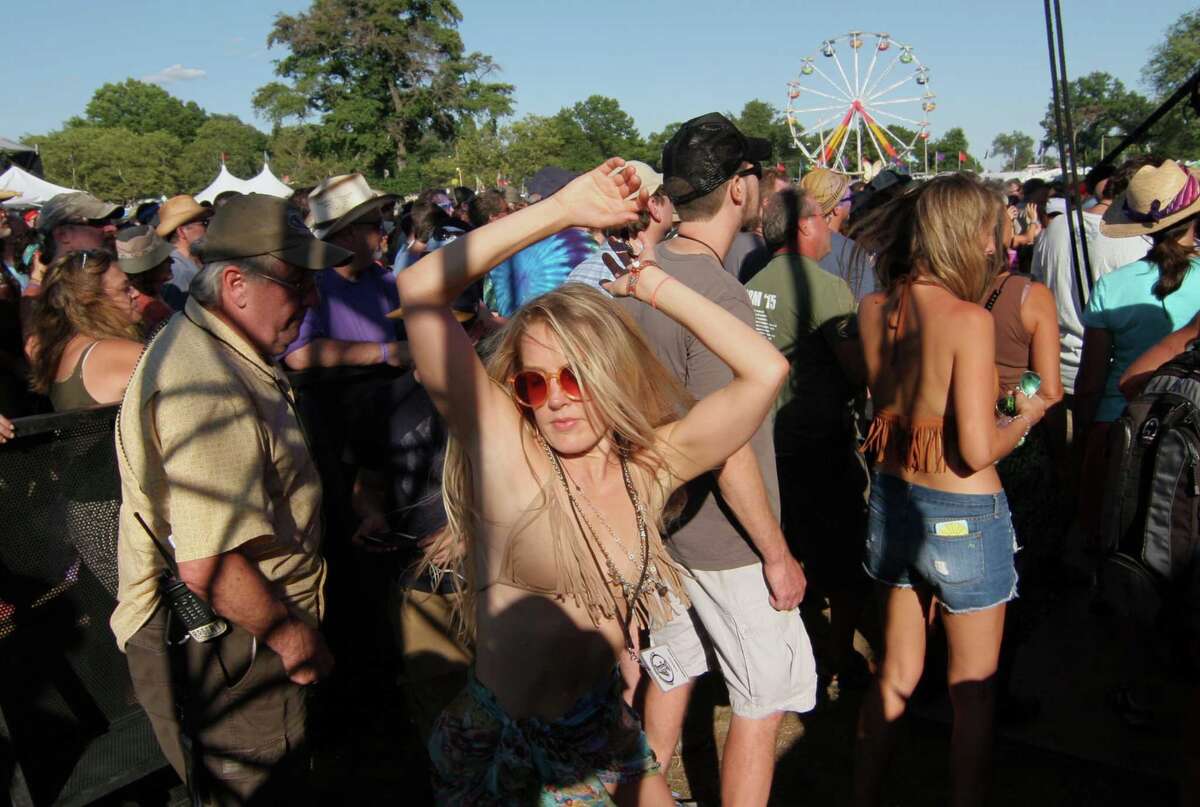 Edith Johnson, who is the blogger Festival Girl, dances to the sounds of the Tedeschi Trucks Band during the Gathering of the Vibes at Seaside Park in Bridgeport, Conn., on Friday July 31, 2015.