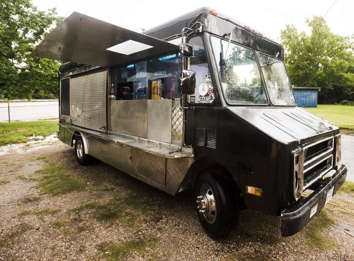 The Dat Mac truck sits outside the Texas Rose Saloon on Tuesday evening. The mobile restauranteurs behind the Dat Mac food truck serve up gourmet macaroni and cheese dishes. Photo taken Tuesday 6/30/15 Jake Daniels/The Enterprise