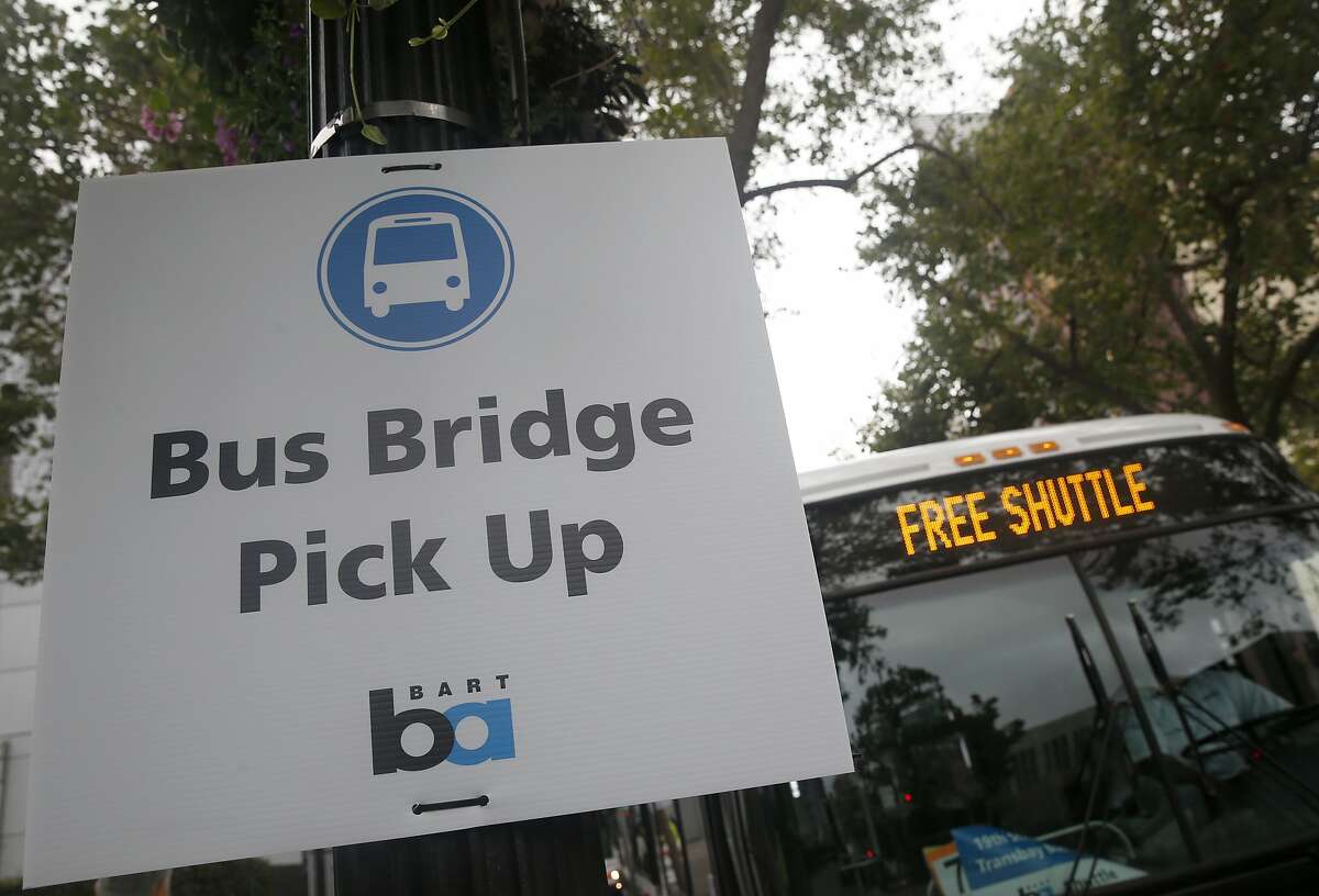 A bus bridge to San Francisco is set up at the 19th Street BART station in Oakland, Calif. on Saturday, Aug. 1, 2015. BART has shut down transbay service for the weekend to perform major track maintenance between the West Oakland station and the entrance to the tube.