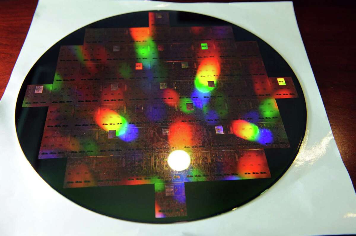 A 300mm wafer created using 3D-integration technology developed at SUNY Polytechnic to bond photonics chips to a base Si chip carrier or interposer on Thursday, July 30, 2015, at Albany Nanotech in Albany, N.Y. (Cindy Schultz / Times Union)