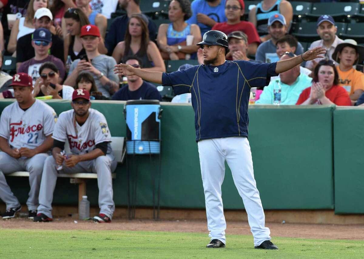 San Antonio Missions first base coach Diego Goris, who also plays shortstop on the team, gestures after a close play during Texas League action against Frisco at Wolff Stadium on Saturday, Aug. 1, 2015.