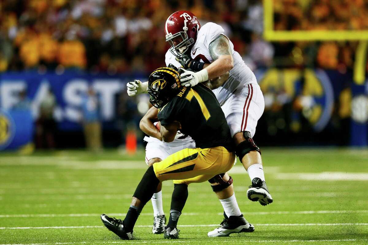 ATLANTA, GA - DECEMBER 06: Austin Shepherd #79 of the Alabama Crimson Tide blocks Maty Mauk #7 of the Missouri Tigers in the second quarter of the SEC Championship game at the Georgia Dome on December 6, 2014 in Atlanta, Georgia. (Photo by Kevin C. Cox/Getty Images)